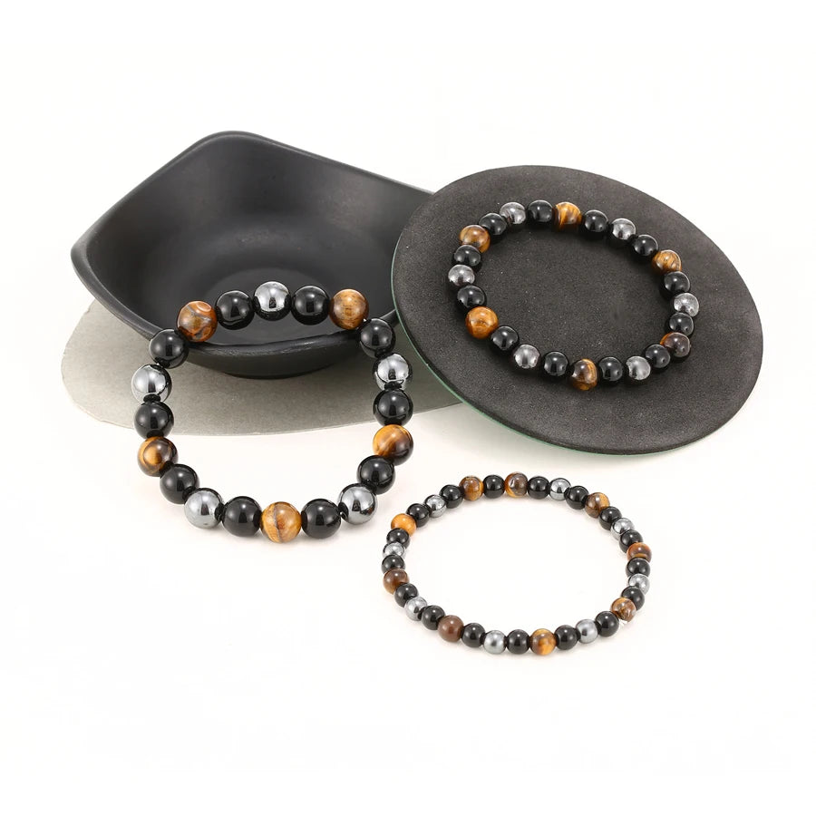 Bracelet en perles d'œil de tigre, obsidienne et hématite